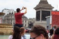 Man taking a photo at Canada Day celebrations in London`s Trafalgar Square 2017