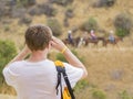 Man taking photo of Horseback riding in Hollywood Hills trail Royalty Free Stock Photo