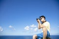 Man taking photo of ocean view
