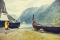 Man taking photo from old viking boat in norway Royalty Free Stock Photo