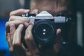 Man taking a photo with an old vintage camera. Royalty Free Stock Photo