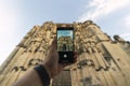 Man taking a photo of St. Mary Parish Church in Arcos de la Frontera