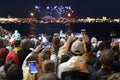 man taking the photo to fireworks with the new smart phone