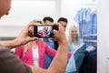 Man Taking Photo Of Young People Shopping, Happy Smiling Friends Two Couple Customers In Fashion Shop Royalty Free Stock Photo