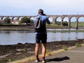 Man Taking Photograph Of Trains In The UK Berwick-Upon-Tweed