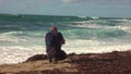 Man taking a photos with dslr camera outdoors, on the beach