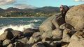 Man taking a photos with dslr camera outdoors, on the beach