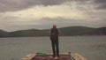 Man taking a photos with dslr camera outdoors, on the beach