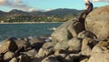 Man taking a photos with dslr camera outdoors, on the beach