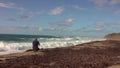 Man taking a photos with dslr camera outdoors, on the beach