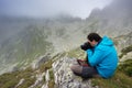 Man taking photos in Retezat National Park, Romania