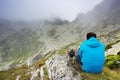 Man taking photos in Retezat National Park, Romania