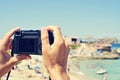 Man taking a picture at Cala Conta beach in San Antonio, Ibiza I Royalty Free Stock Photo