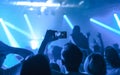 Man taking picture of a concert