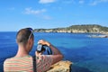 Man taking a picture in Ibiza Island, Spain Royalty Free Stock Photo