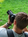 man taking picture on professional dslr camera Royalty Free Stock Photo