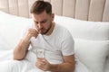 Man taking pill against migraine