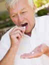 Man Taking Pills Royalty Free Stock Photo