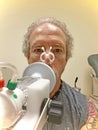 Man Taking Pulmonary Function Test