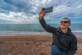 Man taking selfie on the beach Royalty Free Stock Photo