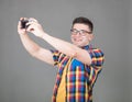 Man taking selfie isolated on gray background Royalty Free Stock Photo