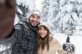 Man Taking Selfie Photo Young Romantic Couple Smile Snow Forest Outdoor