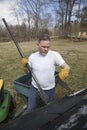 Man taking shingles off a shed roof Royalty Free Stock Photo