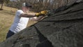 Man taking shingles off a shed roof Royalty Free Stock Photo