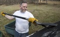 Man taking shingles off a shed roof Royalty Free Stock Photo