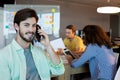 Man talking on his mobile phone at office Royalty Free Stock Photo