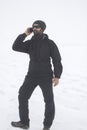 Man talking on phone in the snowy mountain Royalty Free Stock Photo