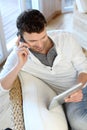 Man talking on the phone using tablet Royalty Free Stock Photo