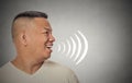 Man talking with sound waves coming out of his open mouth