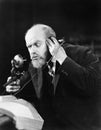 Man talking on the telephone looking intense Royalty Free Stock Photo