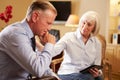 Man Talking To Female Counsellor Using Digital Tab