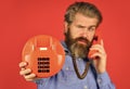 Man talking to vintage phone. businessman talking on vintage phone. buy new gadget. phone business concept. Businessman Royalty Free Stock Photo