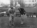 Man talking to woman while golfing Royalty Free Stock Photo