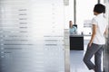 Man Talking To Woman Standing In Office Doorway