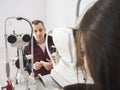 Man talks to the Ophthalmologist during an eyes exam with Slit L Royalty Free Stock Photo