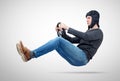 Man in tank helmet car driver with steering wheel, auto concept Royalty Free Stock Photo