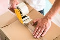 Man taping packing case Royalty Free Stock Photo