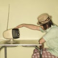 Man tapping old television. Royalty Free Stock Photo