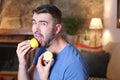 Man tasting a raw lemon Royalty Free Stock Photo