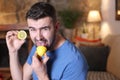 Man tasting a raw lemon Royalty Free Stock Photo