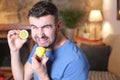 Man tasting a raw lemon Royalty Free Stock Photo