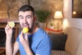 Man tasting a raw lemon Royalty Free Stock Photo