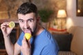 Man tasting a raw lemon Royalty Free Stock Photo