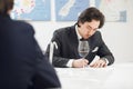 Man Tasting Red wine and Making Notes to Degustation Card. Sommelier Certification Class for Development. Royalty Free Stock Photo