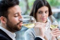 Man tasting white wine in restaurant. Royalty Free Stock Photo
