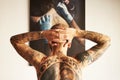 Man, tattoo and back or art with body with creativity or unique or shirtless at house. Tattoos, male person and Royalty Free Stock Photo